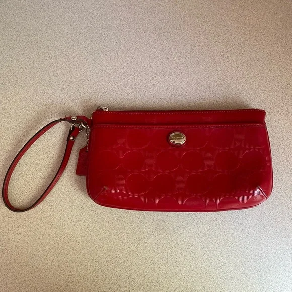 Coach Glossy Embossed Signature Wristlet
Cranberry Patent Leather Red - Picture 5 of 13